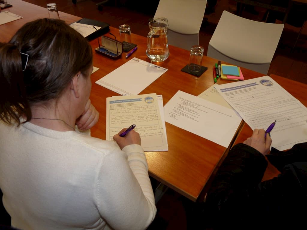 Photo of a woman writing